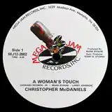 CHRISTPHER MCDANIELS / A WOMAN'S TOUCH